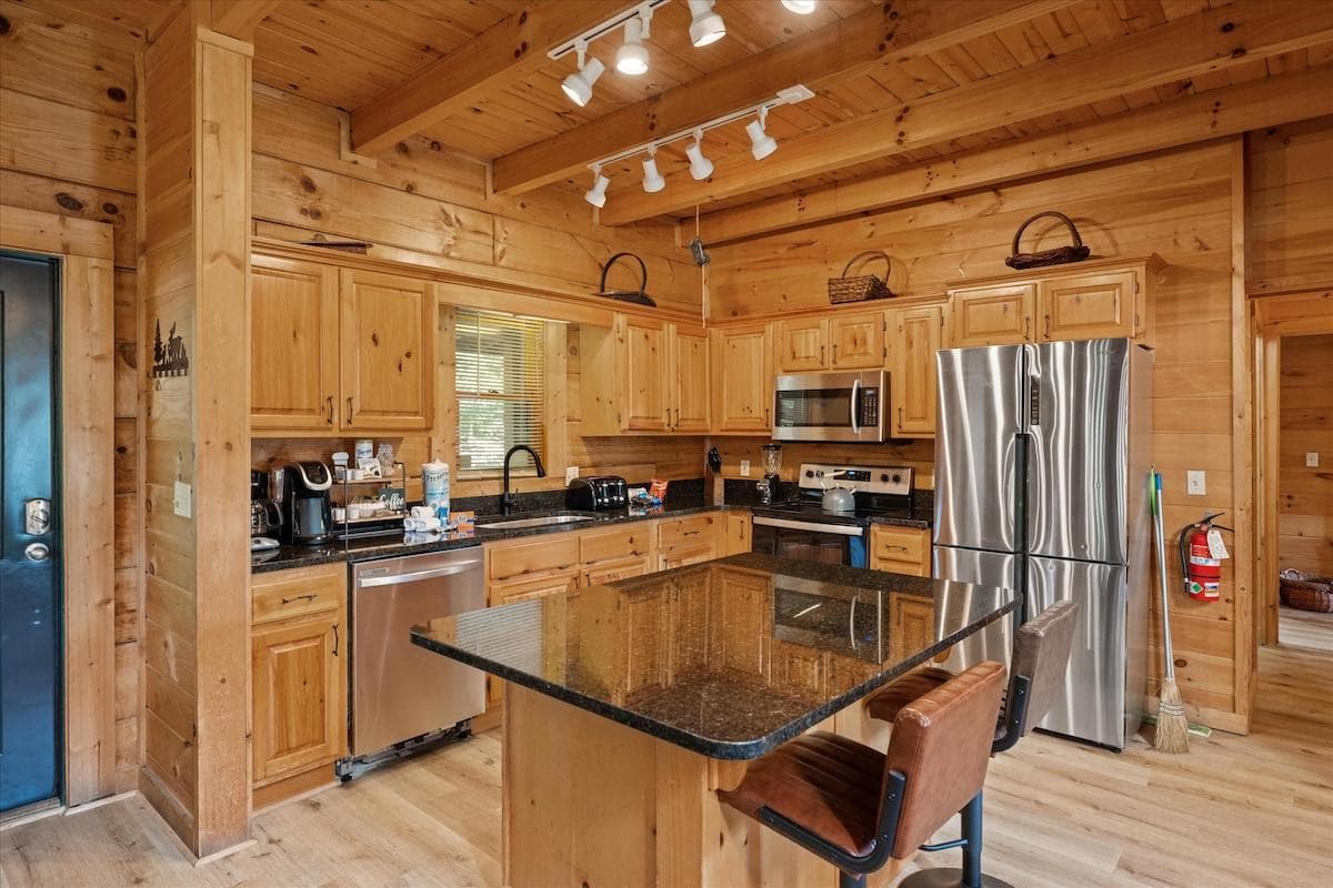 Stainless steel kitchen & all new black granite countertops.